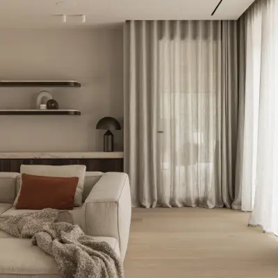Zithoek met sofa en plaid in de open leefruimte met doorkijk, Gezinsvilla in Heusden-Zolder, interieur Laura Calleeuw