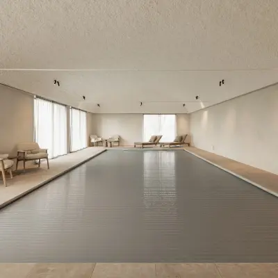 Binnenzwembad met tongewelf, ligstoelen en fauteuils, Schuur in Westkapelle, interieur Laura Calleeuw